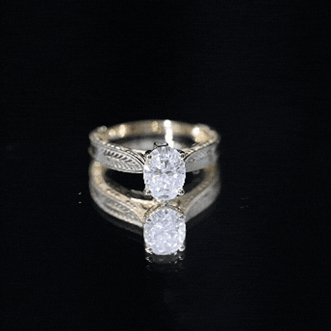 Oval-shaped lab-grown diamond solitaire engagement ring by Rosec Jewels with a claw setting.