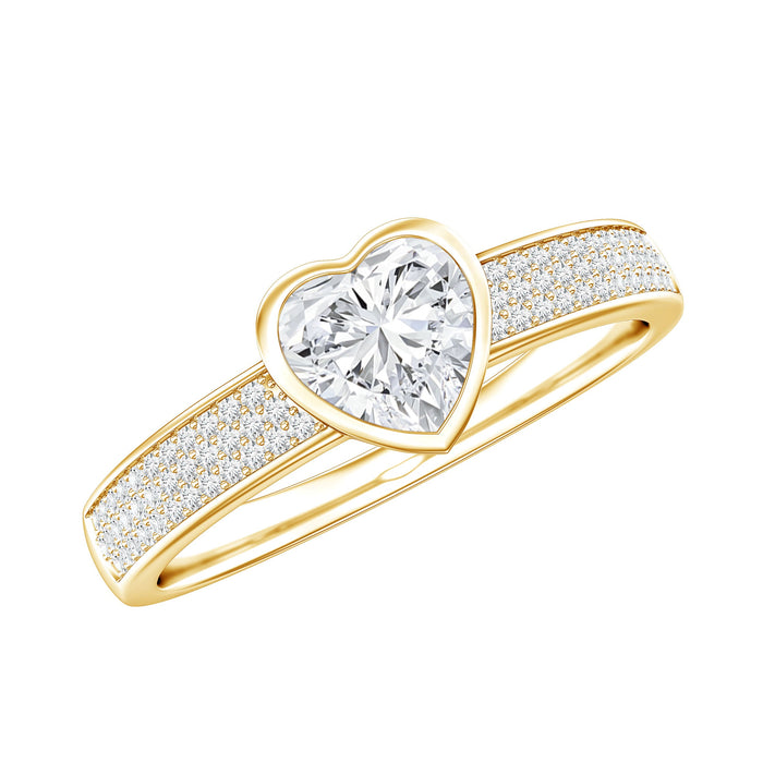 Heart-shaped lab-grown diamond solitaire ring with side stones from Rosec Jewels, showcasing the detailed design and sparkling gemstones.