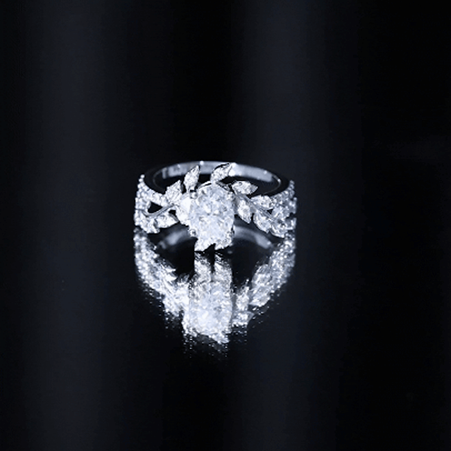 Certified 1.2 carat Moissanite vine engagement ring in silver featuring a sparkling center stone and intricate floral design.