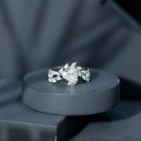 Certified 1.2 carat Moissanite vine engagement ring in silver with intricate design, from Rosec Jewels.