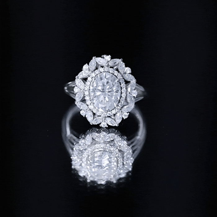 Certified 2 Carat oval Moissanite double halo engagement ring by Rosec Jewels featuring a sparkling central stone and intricate halo design.
