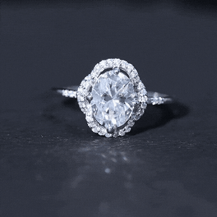 Vintage-inspired 2 carat moissanite engagement ring in silver with intricate detailing, designed by Rosec Jewels.