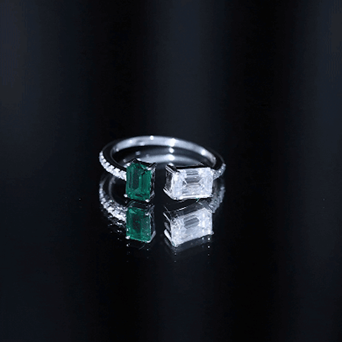 Certified Moissanite and Lab Grown Emerald Toi Et Moi engagement ring from Rosec Jewels, featuring a white band and elegant design.