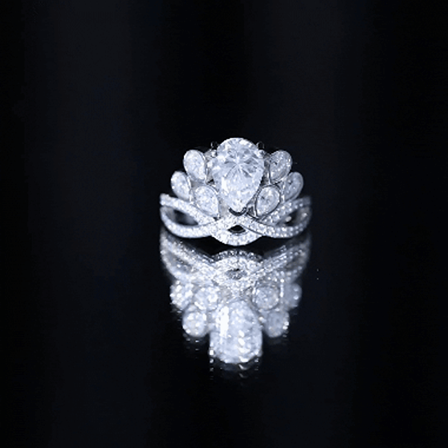 Vintage-inspired moissanite engagement ring with large central stone and intricate band design, by Rosec Jewels.