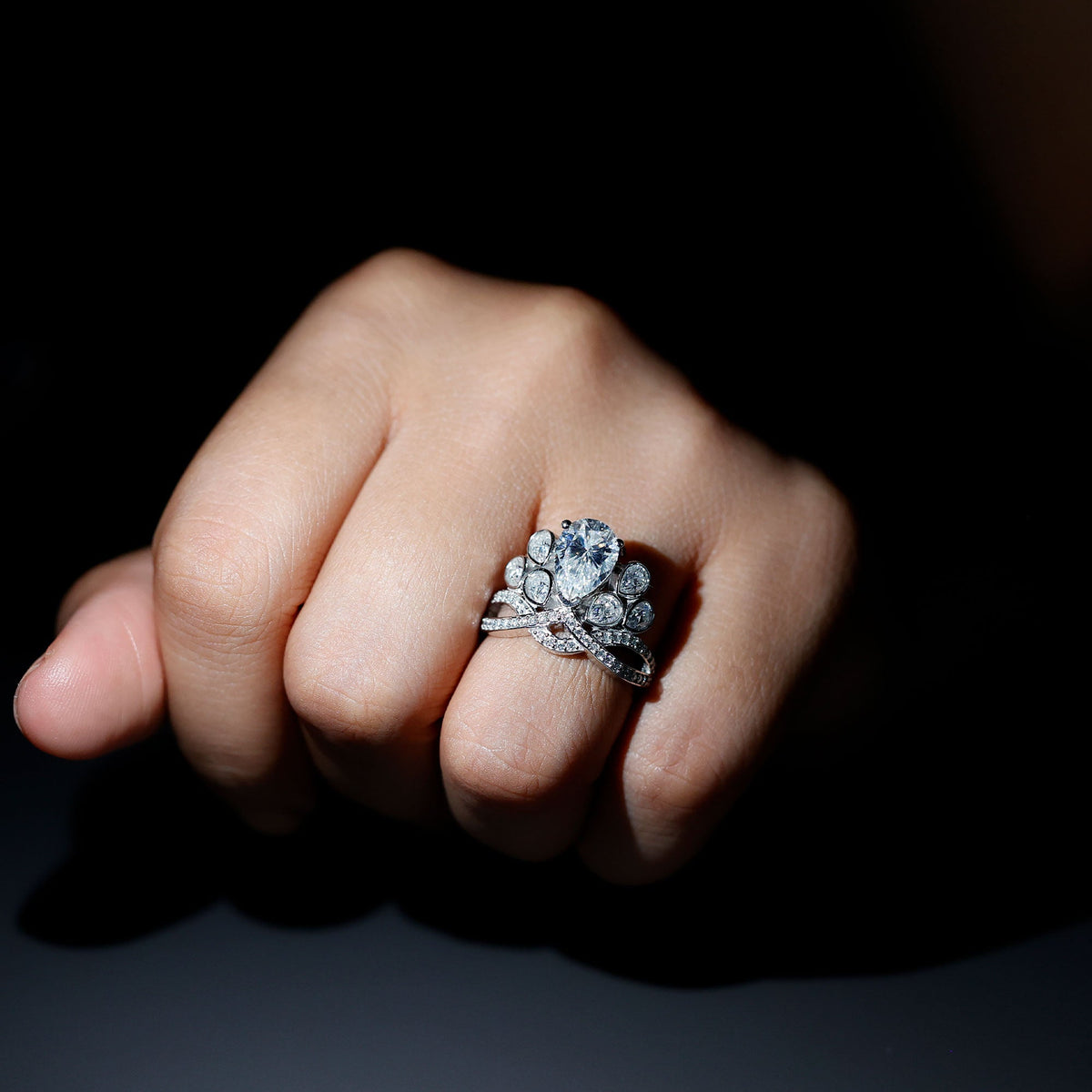 Large vintage-inspired moissanite engagement ring by Rosec Jewels featuring intricate detailing and a prominent sparkling stone.
