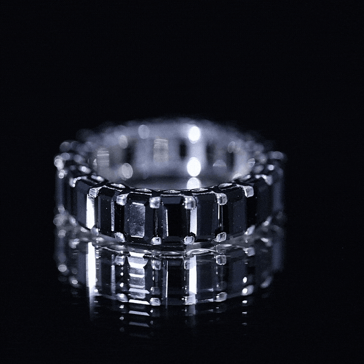 Emerald cut black spinel eternity ring by Rosec Jewels featuring a continuous row of sparkling black spinel gemstones.