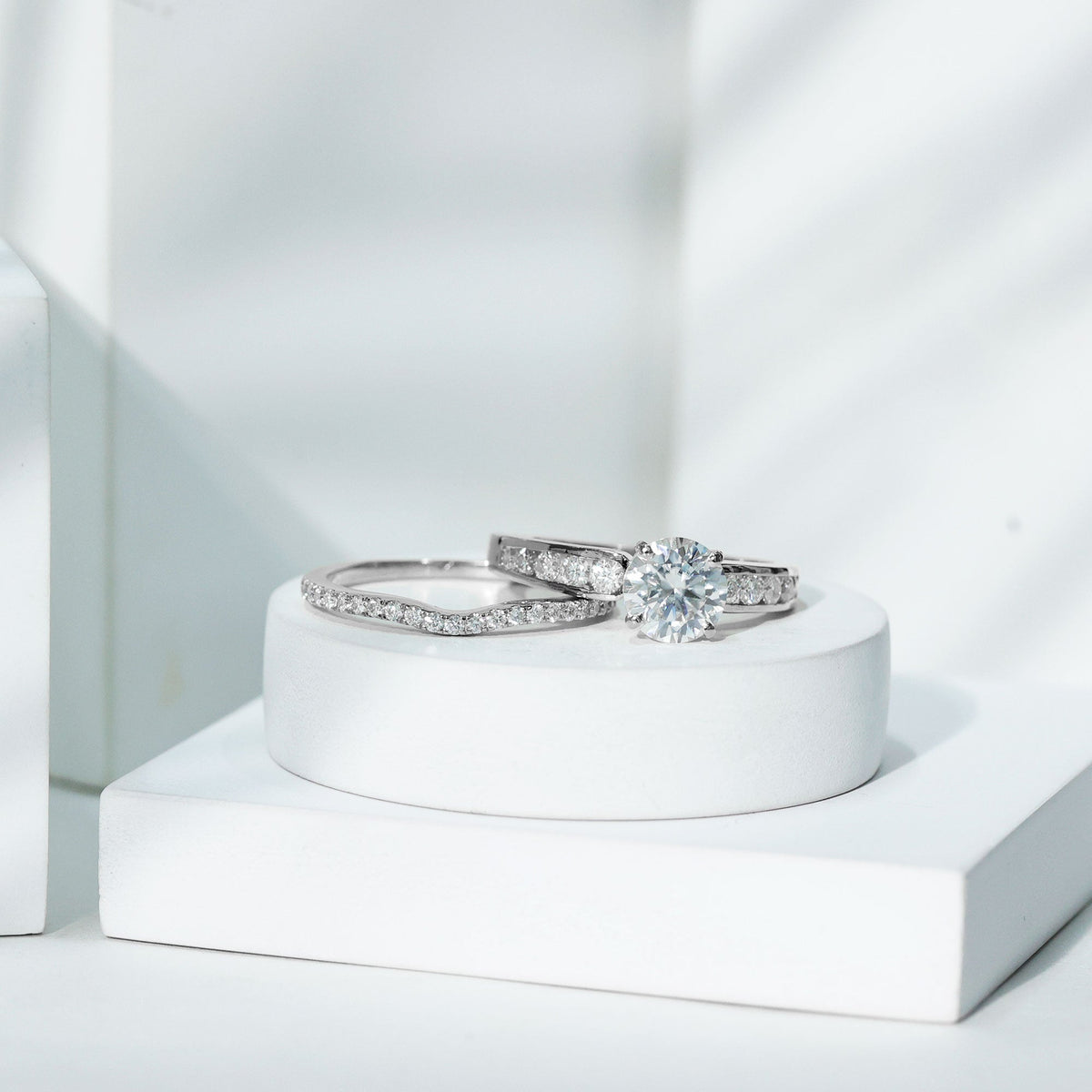 Certified 2 Carat round Moissanite engagement ring with matching wedding band from Rosec Jewels, featuring sparkling gemstone and elegant design.