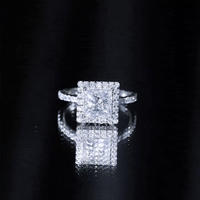 Elegant 3 Carat princess cut moissanite halo engagement ring by Rosec Jewels featuring a sparkling white center stone and intricate band design.