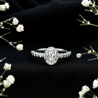 Bezel Set Moissanite Oval Engagement Ring with Side Stones