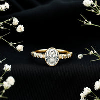 Bezel Set Moissanite Oval Engagement Ring with Side Stones
