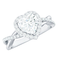 Heart-shaped moissanite halo engagement ring with criss-cross band from Rosec Jewels, featuring sparkling gemstones and intricate design.
