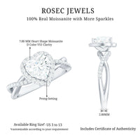 Heart-shaped moissanite halo engagement ring with a criss-cross band, featuring sparkling stones and intricate metalwork from Rosec Jewels.