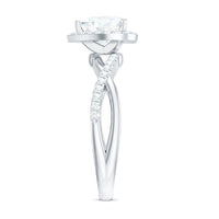 Heart-shaped moissanite halo engagement ring with a criss-cross band from Rosec Jewels, featuring sparkling gemstones and intricate design.