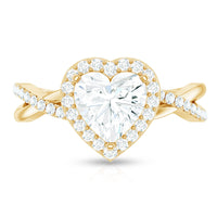 Heart-shaped moissanite halo engagement ring with criss-cross band from Rosec Jewels, featuring sparkling stone details and intricate design.