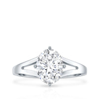 Oval cut moissanite solitaire engagement ring with split shank design by Rosec Jewels, showcasing the sparkling gemstone and elegant band.