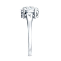 Oval cut moissanite solitaire engagement ring with split shank design from Rosec Jewels, featuring a sparkling central stone.
