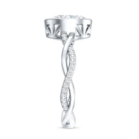 Brilliant cut moissanite bezel set engagement ring with a braided shank in a Rosec Jewels ring design.