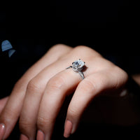 Moissanite hidden halo engagement ring with infinity shank from Rosec Jewels, showcasing sparkling center stone and intricate band design.