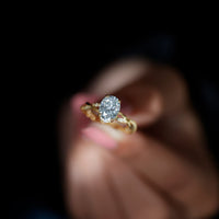 Moissanite hidden halo engagement ring with infinity shank from Rosec Jewels, showcasing sparkling center stone and detailed band design.