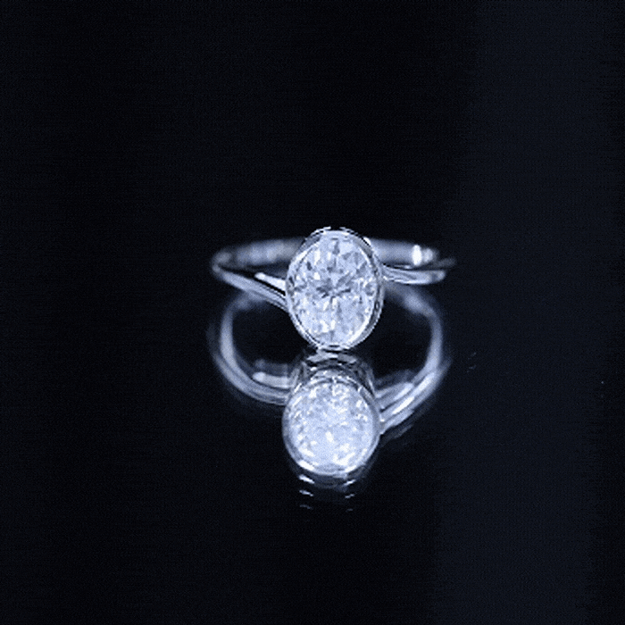 Rosec Jewels solitaire 2 carat moissanite engagement ring with bezel setting and bypass shank, showcasing elegant jewelry design.