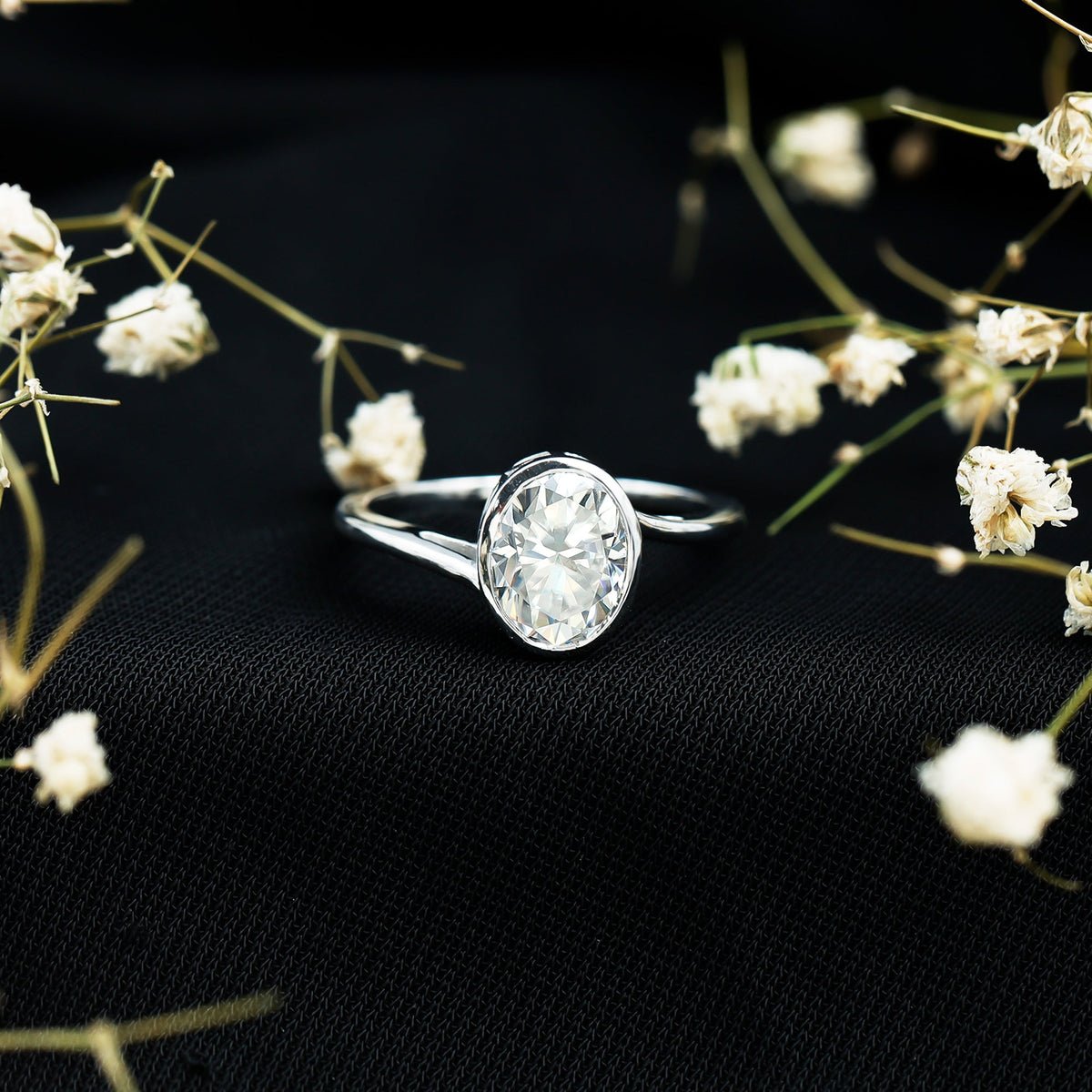 Solitaire 2 Carat Moissanite engagement ring by Rosec Jewels featuring bezel setting and bypass shank design.