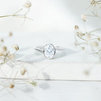 Solitaire 2 Carat Moissanite engagement ring with bezel setting and bypass shank from Rosec Jewels, showcasing a sparkling center stone.