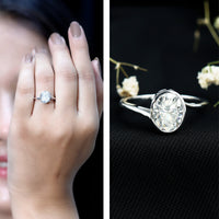 Solitaire 2 carat moissanite bezel set engagement ring with bypass shank by Rosec Jewels, featuring a prominent central stone and elegant design.