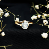 Solitaire 2 Carat Moissanite engagement ring with bezel setting and bypass shank, crafted by Rosec Jewels