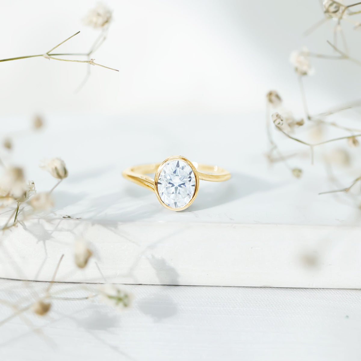 Solitaire 2 carat moissanite bezel set engagement ring with bypass shank by Rosec Jewels, featuring a sparkling center stone and sleek design.