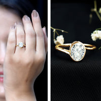 Two-carat moissanite solitaire engagement ring with bezel setting and bypass shank by Rosec Jewels, showcasing elegant ring design.