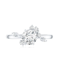 Round cut scatter moissanite engagement ring by Rosec Jewels featuring a unique design with sparkling stones on a sleek band.