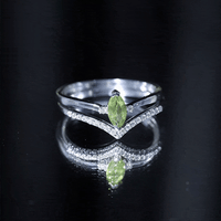 Marquise cut peridot solitaire wedding ring set with diamond accents, featuring yellow gold band from Rosec Jewels.