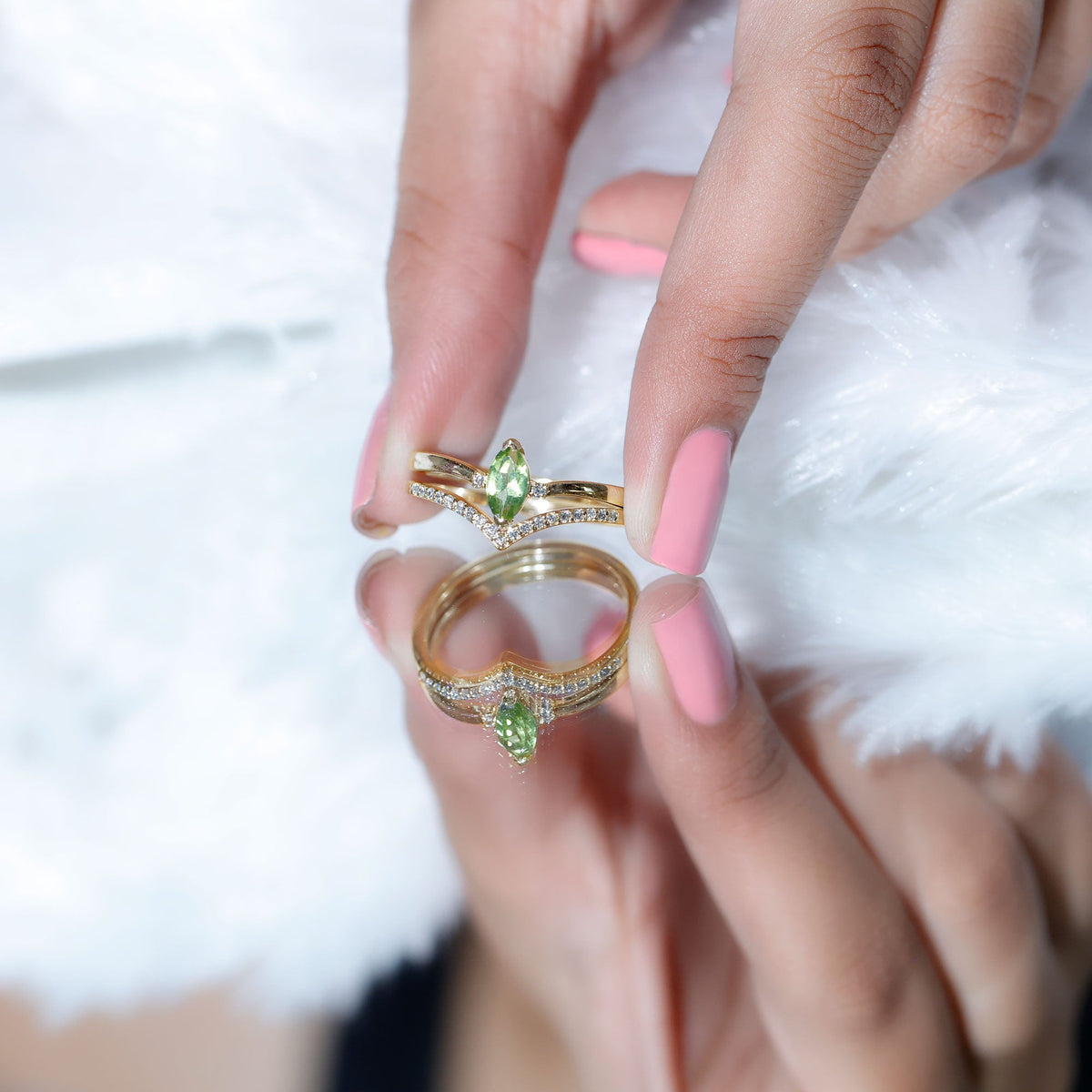 Marquise cut peridot solitaire wedding ring set with diamond accents, featuring a gold band and elegant gemstone design.