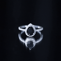 Certified 0.85 Carat Pear Shape Lab Grown Black and White Diamond Halo Engagement Ring