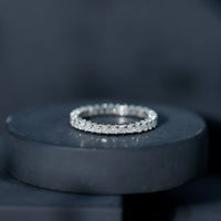 Rosec Jewels princess cut cubic zirconia eternity wedding band ring with sparkling stones and a certificate, showcasing elegant design.