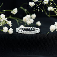 Rosec Jewels princess cut cubic zirconia eternity wedding band ring with certificate, featuring sparkling stones and a sleek silver band.