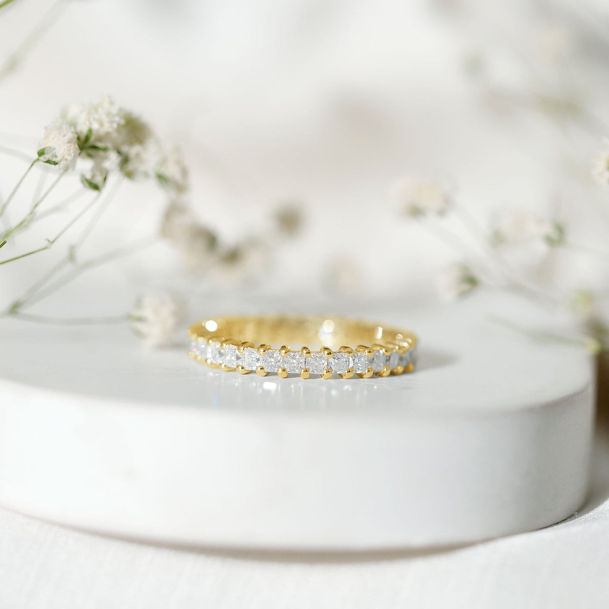 Rosec Jewels princess cut cubic zirconia eternity wedding band ring with a certificate, featuring sparkling stones and a sleek design.