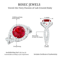 Round created ruby crossover engagement ring with Moissanite from Rosec Jewels, showcasing the intricate band design and sparkling stones.