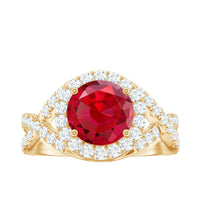 Round created ruby crossover engagement ring with moissanite accents by Rosec Jewels, featuring a polished gold band and intricate design.