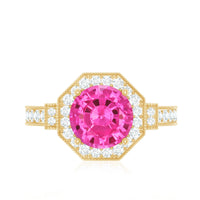 Lab-created pink sapphire vintage engagement ring with diamond halo, featuring intricate detailing and sparkling gemstones.