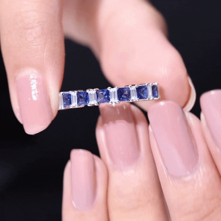 Princess cut blue sapphire half eternity ring with diamonds from Rosec Jewels, showcasing sparkling gemstones and elegant design.