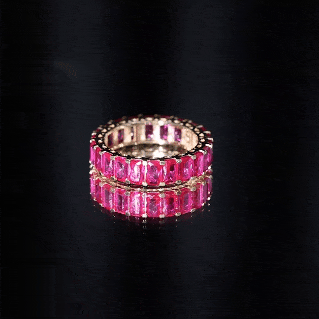 Emerald cut lab-grown ruby full eternity wide band ring by Rosec Jewels with alternating vibrant red gemstones and yellow gold band.