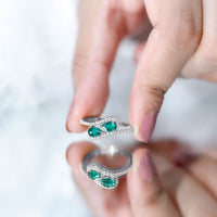 Pear Shape Created Emerald and Diamond Bypass Engagement Ring