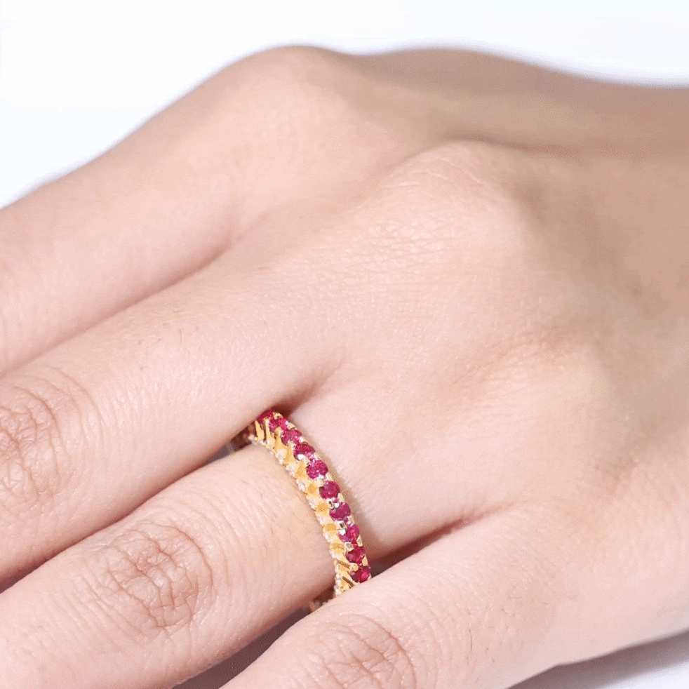 Round lab-grown ruby and diamond eternity wedding band by Rosec Jewels, showcasing a continuous circle of sparkling gemstones.