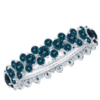 Rosec Jewels London Blue Topaz Cluster Eternity Band Ring with vibrant blue gemstones and intricate silver setting.