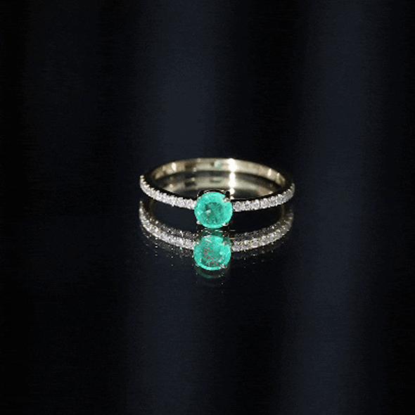 Natural emerald promise ring by Rosec Jewels featuring a central emerald and diamond side stones in a sleek gold band