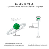 Natural emerald promise ring with diamond side stones from Rosec Jewels, featuring a central emerald gemstone and sparkling accents.