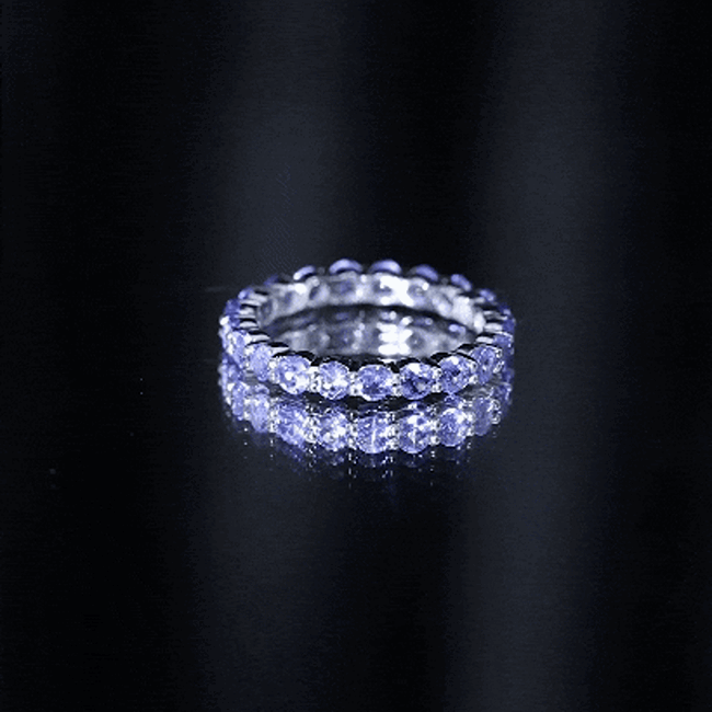 Yellow gold eternity ring for women featuring real Tanzanite stones, crafted by Rosec Jewels.