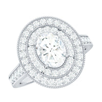 Oval moissanite engagement ring with milgrain details and double halo setting by Rosec Jewels, close-up view of the intricate design.