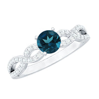 Round blue topaz infinity engagement ring with diamonds by Rosec Jewels, featuring a blue topaz centerpiece and sparkling diamond accents.